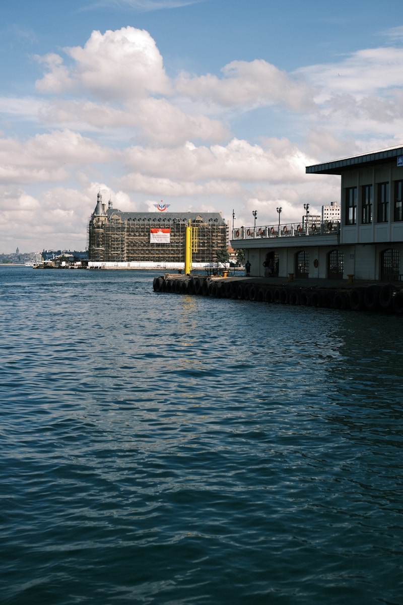 A large body of water with a building in the background